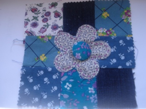 Blue floral fabrics with applique flower & covered button